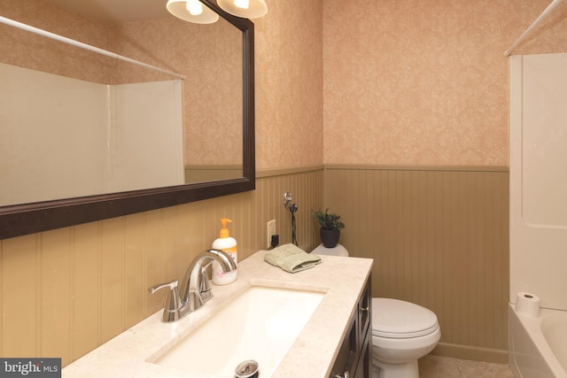 full bathroom featuring vanity, tile patterned floors, toilet, and shower / bath combination