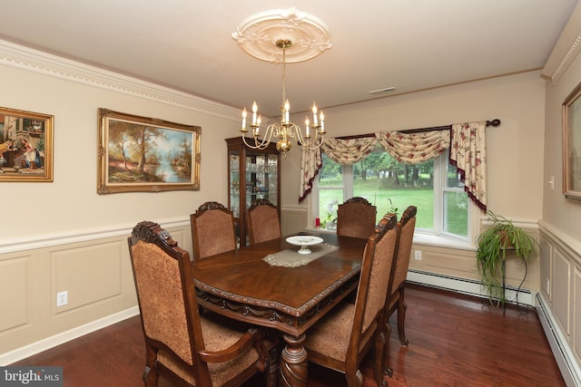 dining area featuring an inviting chandelier, ornamental molding, dark hardwood / wood-style flooring, and baseboard heating