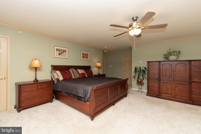 bedroom with ceiling fan, ornamental molding, and light carpet