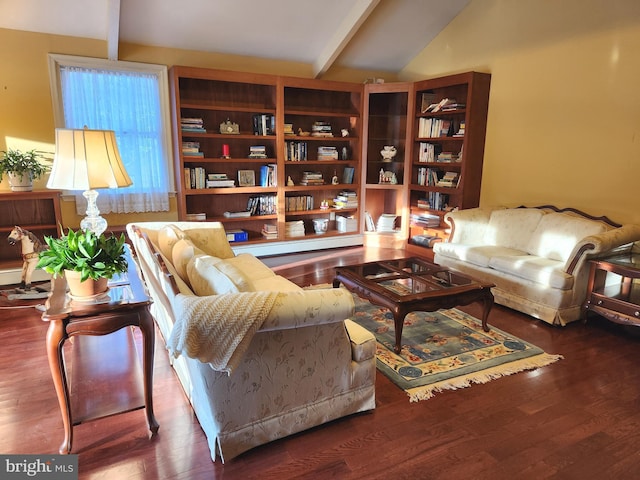 living room with hardwood / wood-style flooring and vaulted ceiling with beams