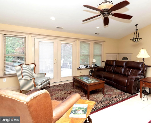 living room with french doors and ceiling fan