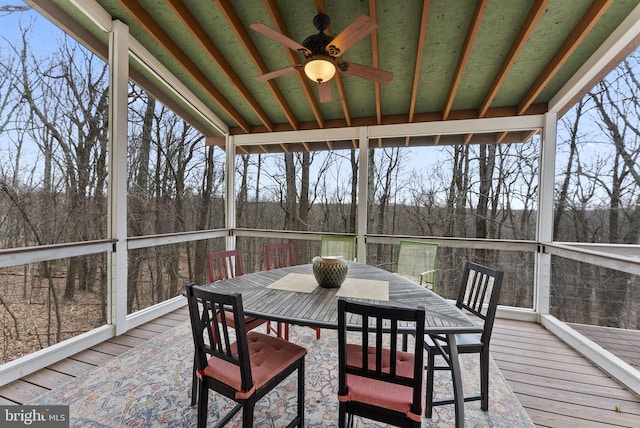 sunroom / solarium featuring ceiling fan