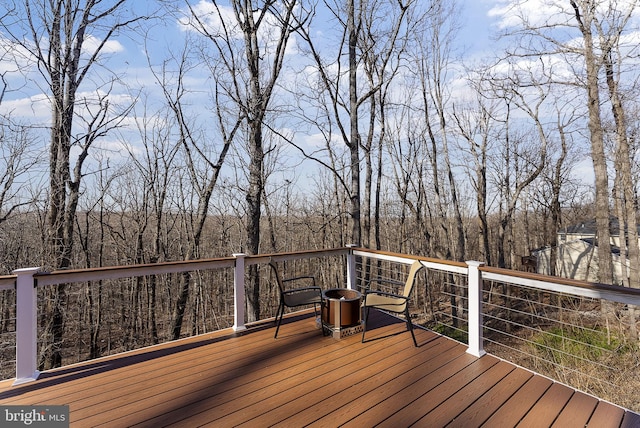 deck featuring a view of trees