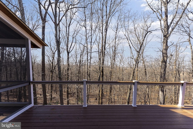 deck featuring a view of trees