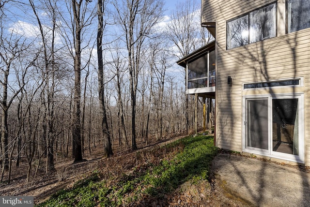 view of home's exterior featuring a sunroom