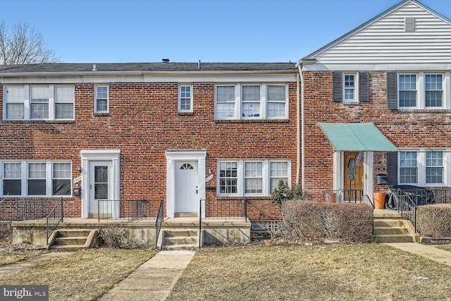 view of property with a front lawn