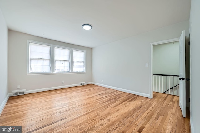 unfurnished room with light hardwood / wood-style floors