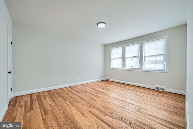 empty room with light wood-type flooring