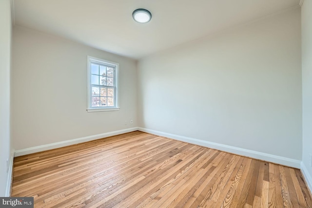 spare room with light wood-type flooring