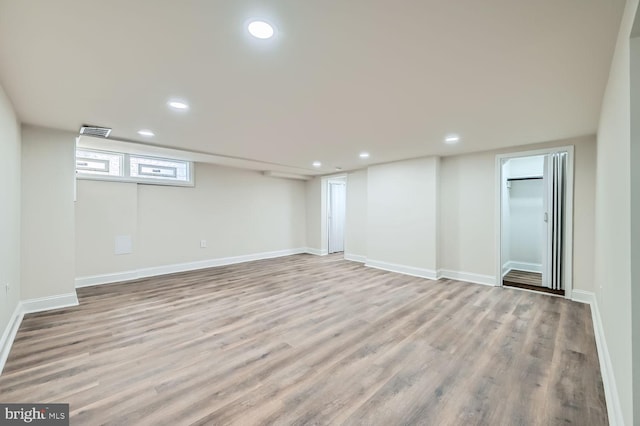 basement featuring light hardwood / wood-style flooring