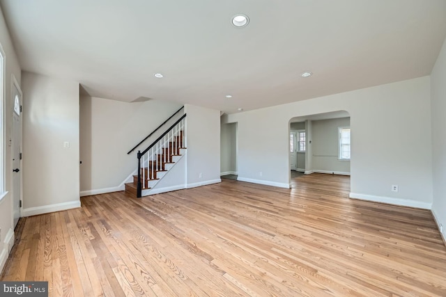 unfurnished living room featuring light wood-type flooring