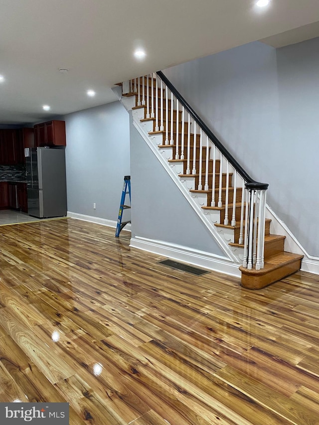 unfurnished living room with hardwood / wood-style floors