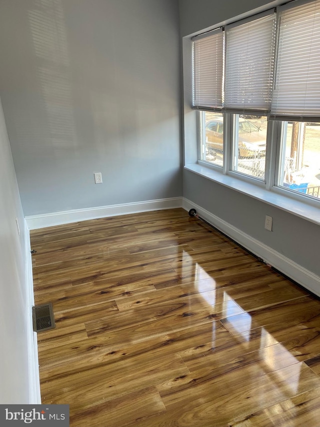 empty room featuring hardwood / wood-style flooring