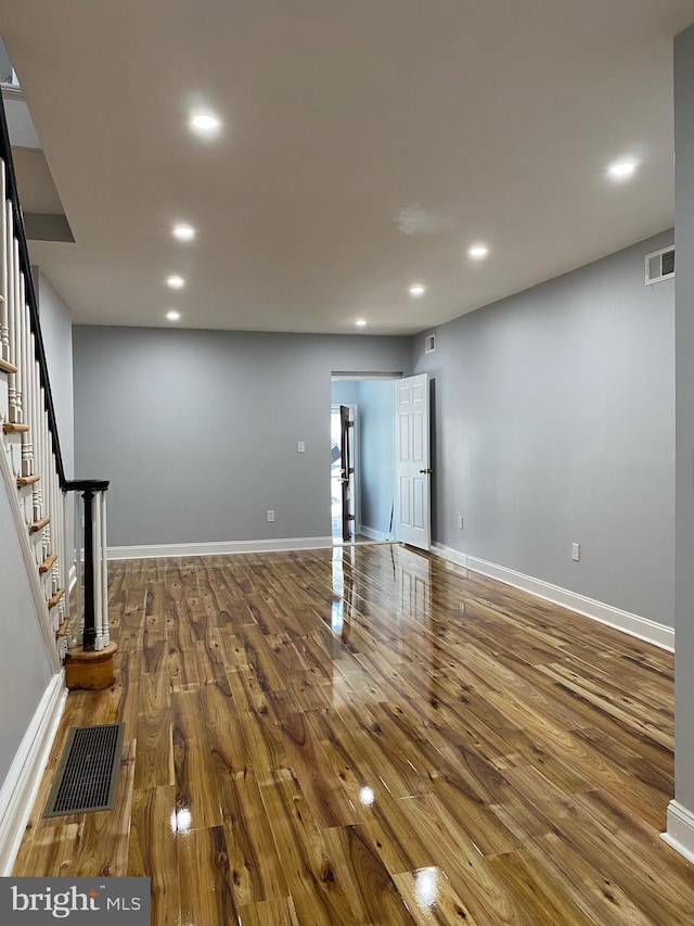 basement with hardwood / wood-style floors