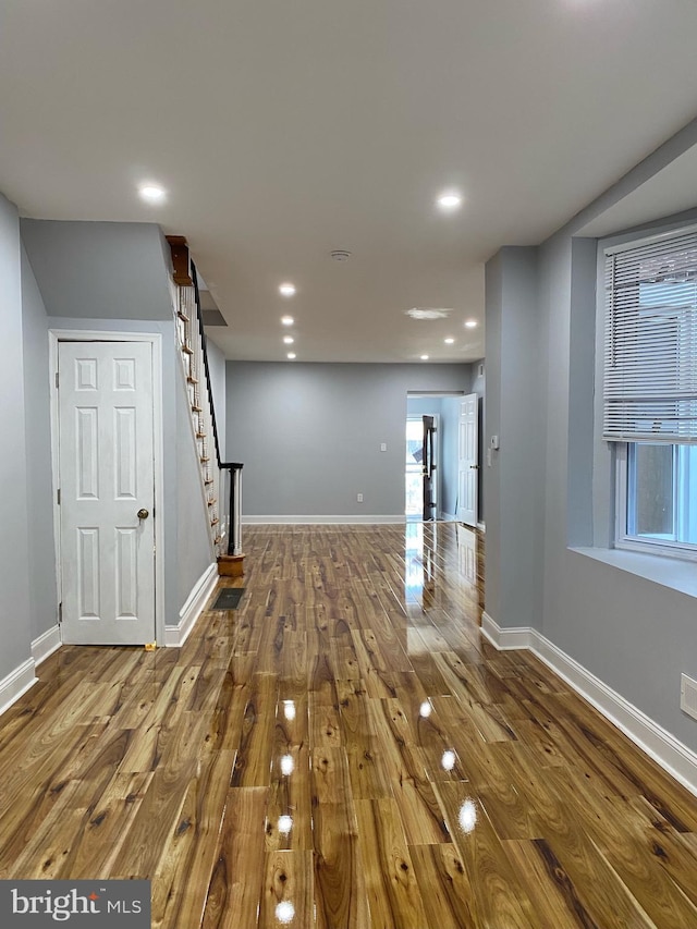 interior space featuring hardwood / wood-style flooring and plenty of natural light