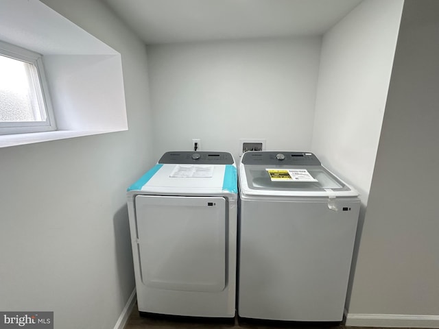 laundry room featuring washing machine and clothes dryer