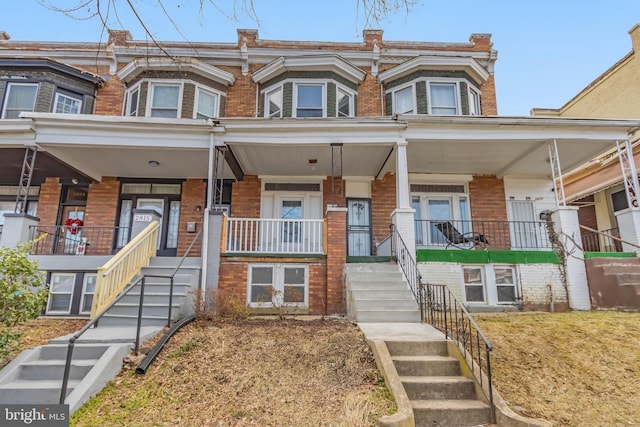 townhome / multi-family property with covered porch