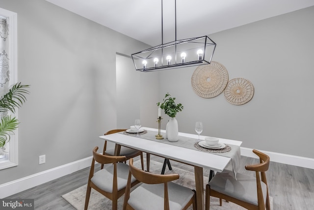 dining area with hardwood / wood-style flooring