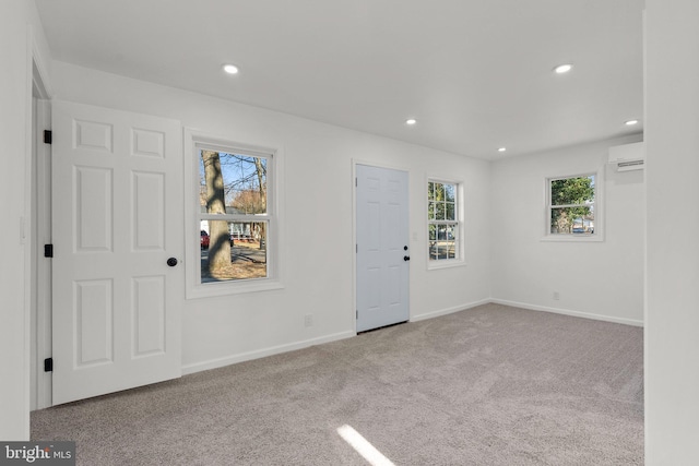 interior space with recessed lighting, light colored carpet, and baseboards