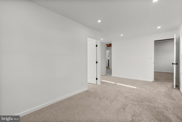 interior space featuring baseboards, carpet floors, and recessed lighting