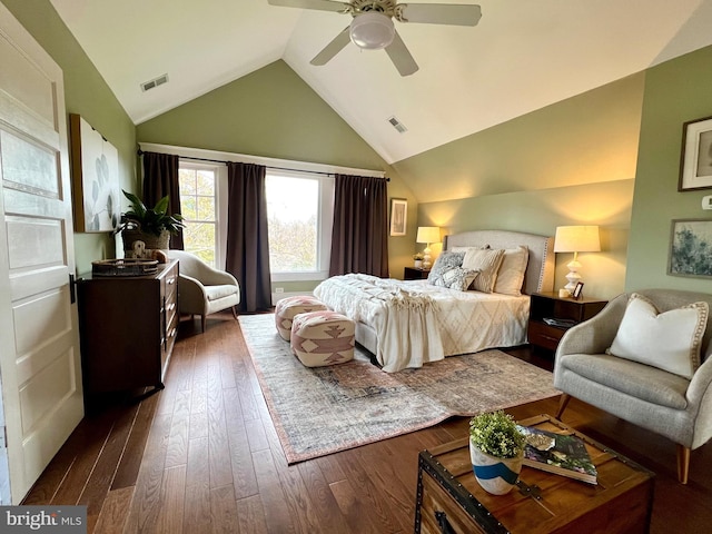 bedroom featuring ceiling fan, lofted ceiling, and dark hardwood / wood-style flooring