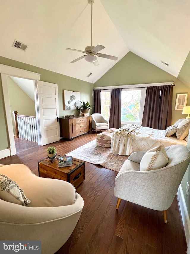 living room featuring vaulted ceiling, ceiling fan, and dark hardwood / wood-style flooring