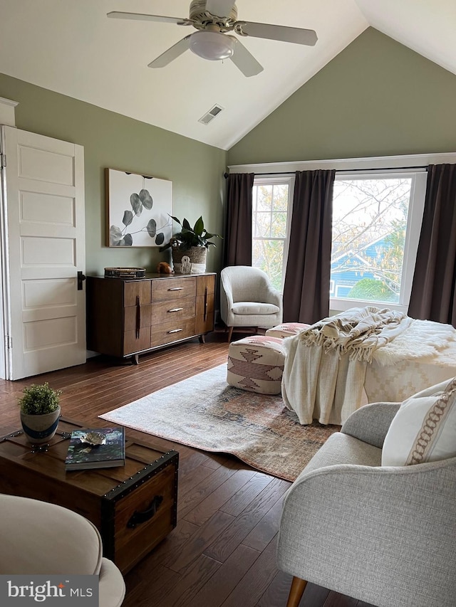 living room featuring ceiling fan, lofted ceiling, and dark hardwood / wood-style flooring