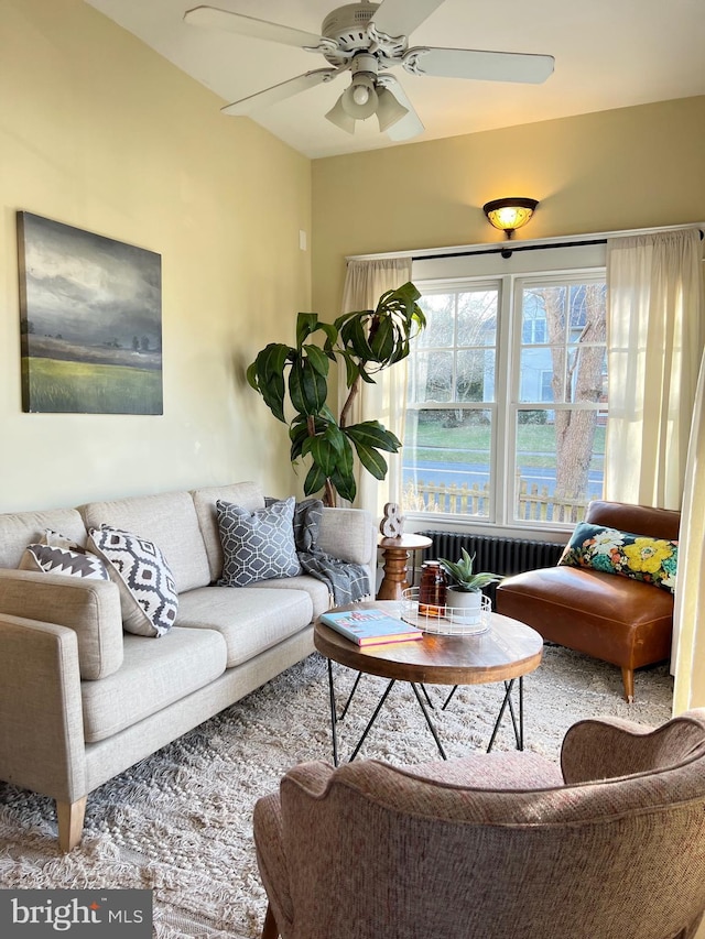 living room featuring radiator and ceiling fan