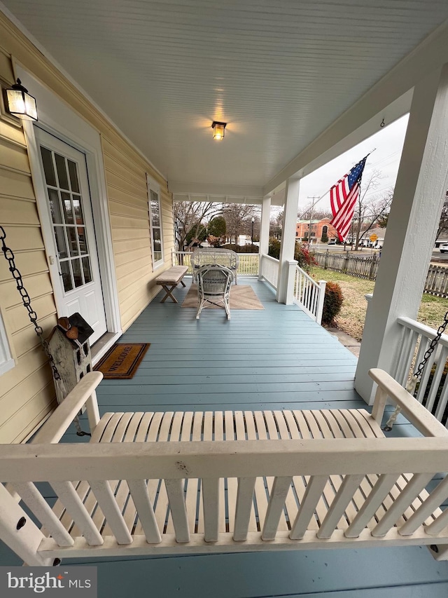 wooden deck featuring covered porch