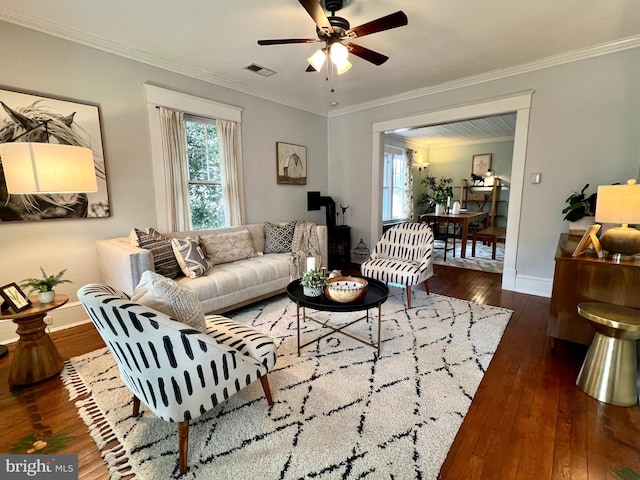 living room with crown molding, dark hardwood / wood-style floors, and ceiling fan