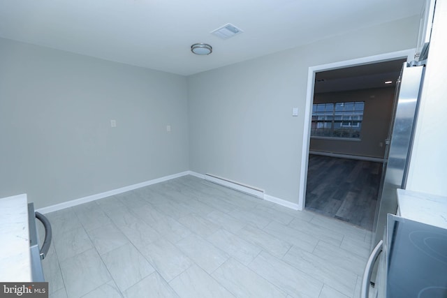 empty room featuring baseboard heating, a baseboard radiator, visible vents, and baseboards