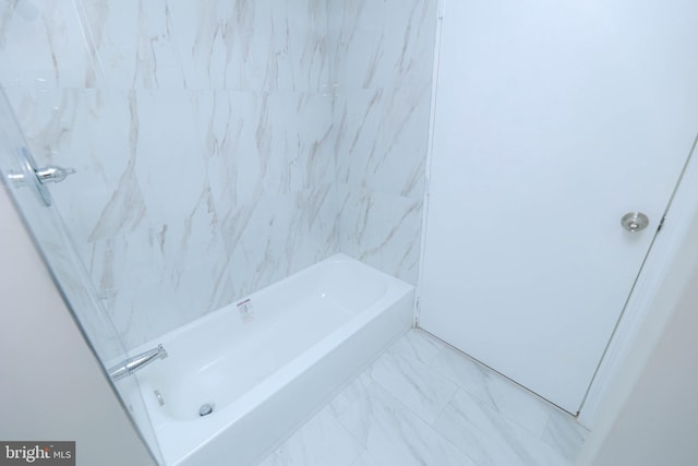 full bath with marble finish floor and shower / tub combination