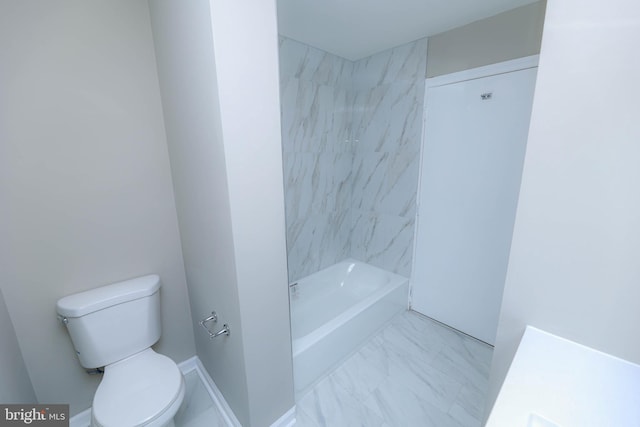 full bathroom featuring toilet, marble finish floor, and baseboards