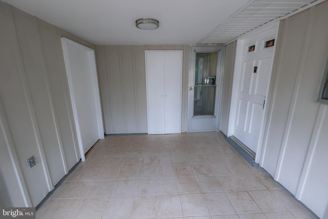 hallway featuring light tile patterned flooring