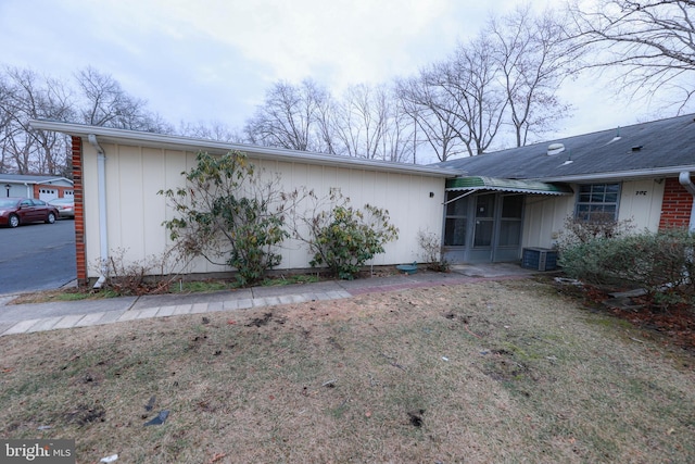 view of side of property featuring central AC unit