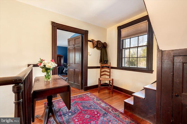 interior space featuring hardwood / wood-style flooring and baseboards