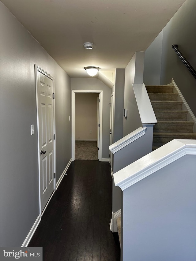 hallway with dark hardwood / wood-style floors