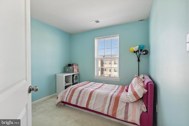 bedroom with light carpet