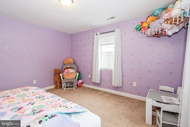 bedroom with light colored carpet