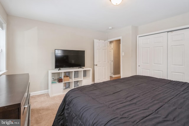 carpeted bedroom with a closet