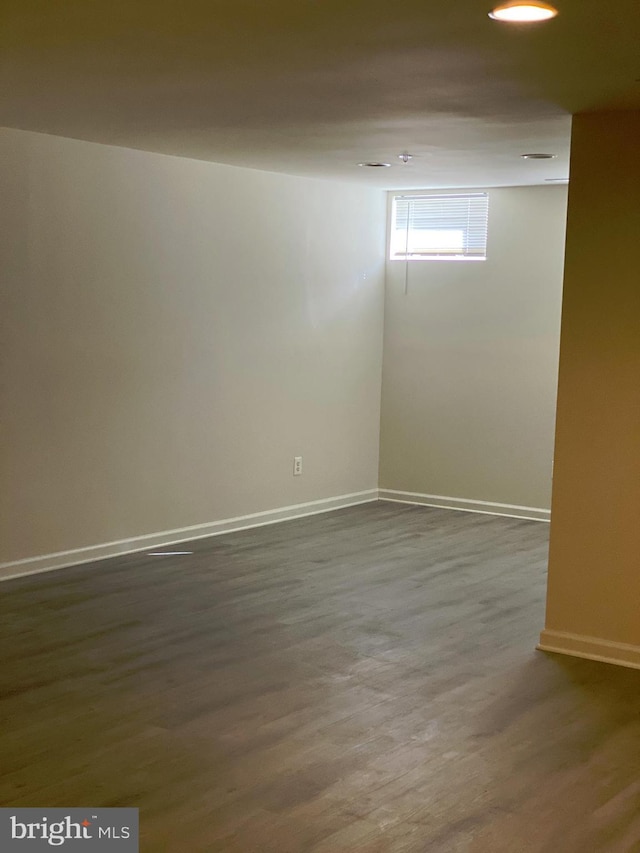 basement with wood-type flooring