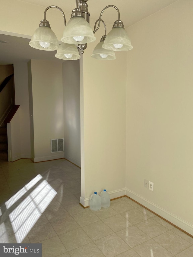 unfurnished dining area featuring light tile patterned flooring