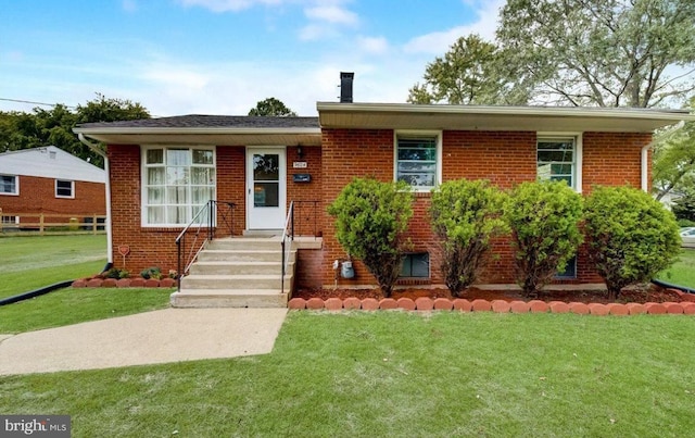 view of front facade with a front lawn and brick siding