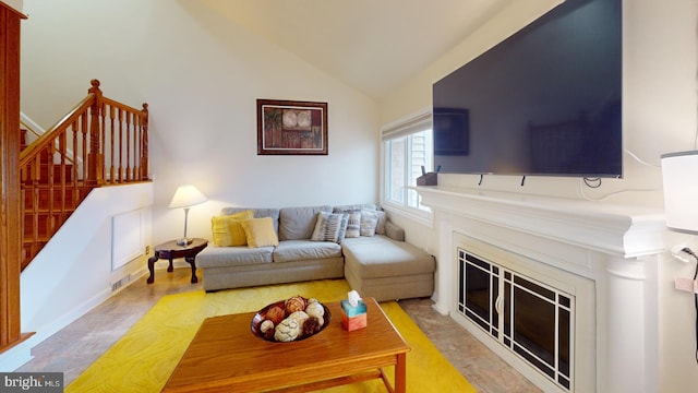 living room with vaulted ceiling and light hardwood / wood-style flooring