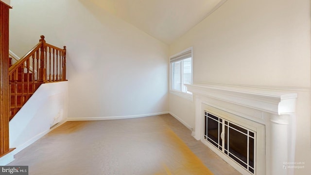 unfurnished living room with lofted ceiling