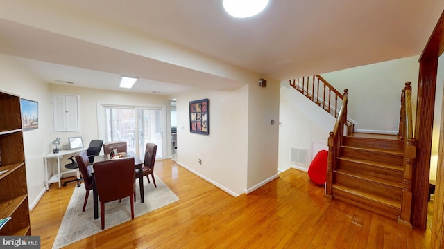 dining space with light hardwood / wood-style flooring