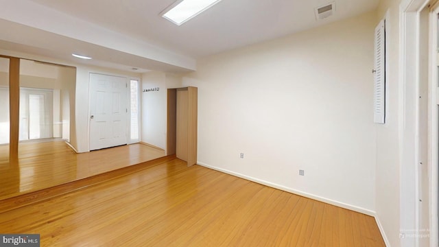 spare room featuring hardwood / wood-style floors