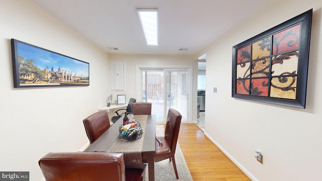 dining area with hardwood / wood-style floors