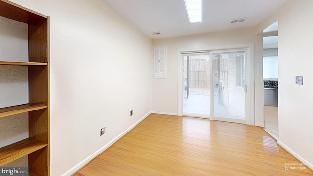 unfurnished room featuring light hardwood / wood-style flooring