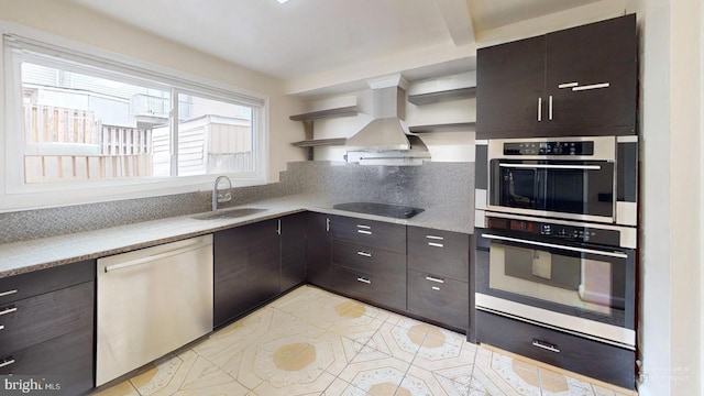 kitchen with light tile patterned flooring, stainless steel appliances, sink, and dark brown cabinets